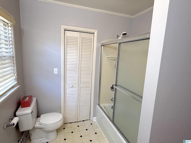 1807 Moncrief Rd, Gardendale, AL 35071 - full bathroom with a closet, toilet, enclosed tub / shower combo, ornamental molding, and tile patterned floors