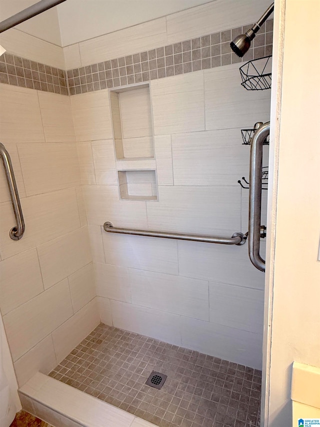 bathroom with tiled shower