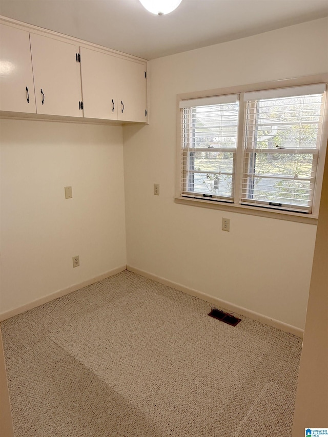1807 Moncrief Rd, Gardendale, AL 35071 - spare room featuring carpet floors and baseboards
