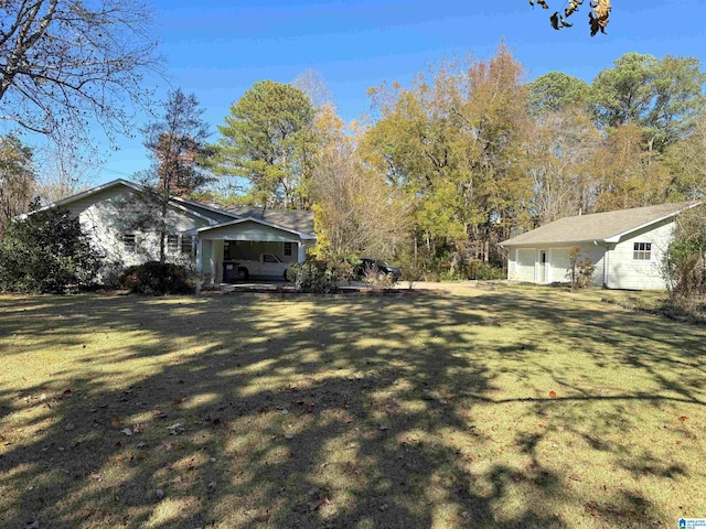 1807 Moncrief Rd, Gardendale, AL 35071 - view of green lawn with a carport