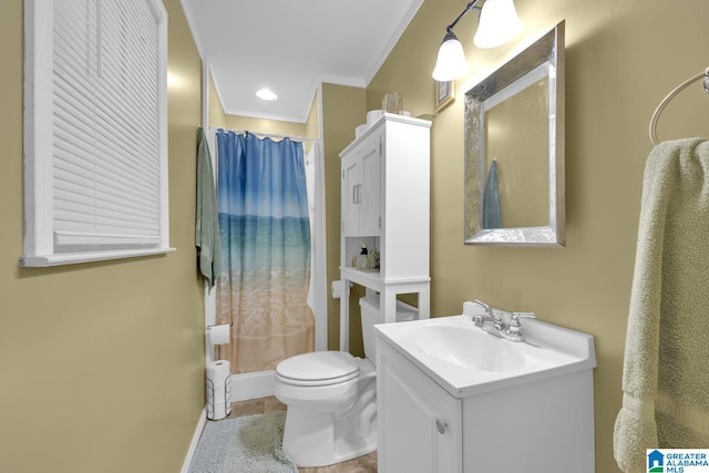 bathroom with vanity, toilet, walk in shower, and crown molding