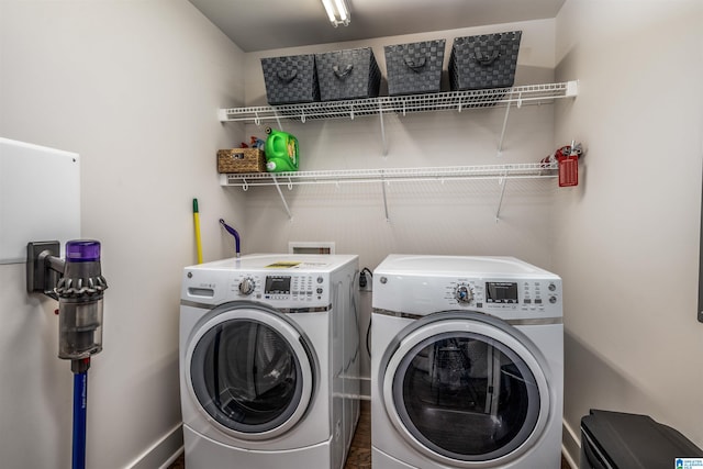 laundry area featuring washing machine and clothes dryer