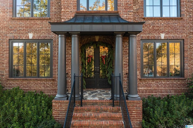 view of exterior entry featuring french doors