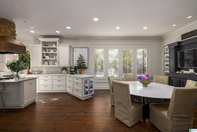 dining room with dark hardwood / wood-style flooring and ornamental molding