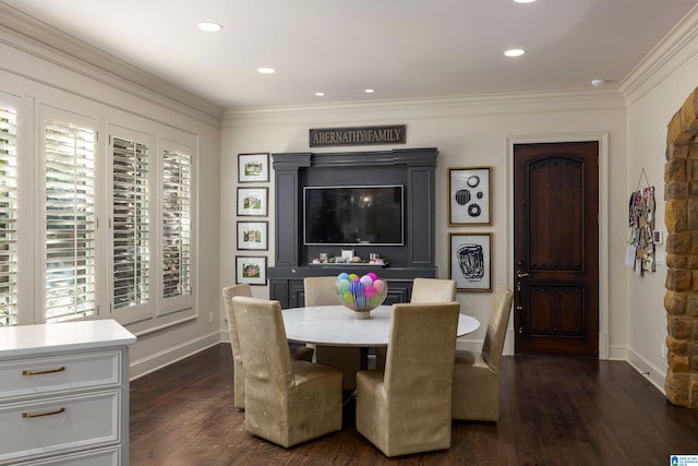 dining space featuring dark hardwood / wood-style flooring, crown molding, and plenty of natural light