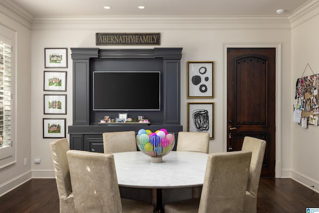 dining room with dark hardwood / wood-style flooring and ornamental molding