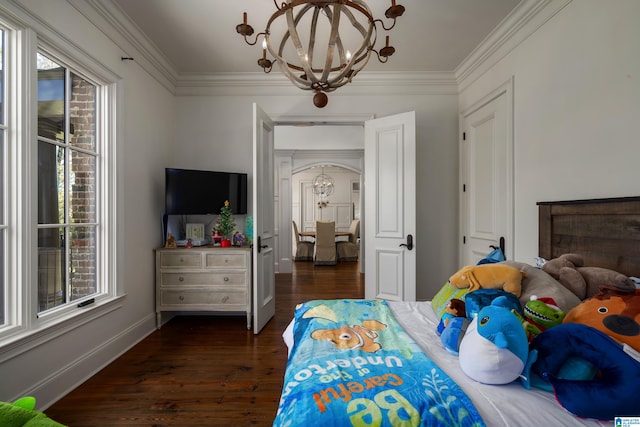 bedroom featuring a chandelier, dark hardwood / wood-style floors, and crown molding