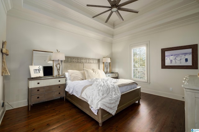 bedroom featuring dark hardwood / wood-style flooring, a tray ceiling, ceiling fan, and ornamental molding