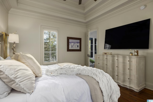 bedroom with ceiling fan, crown molding, and dark wood-type flooring