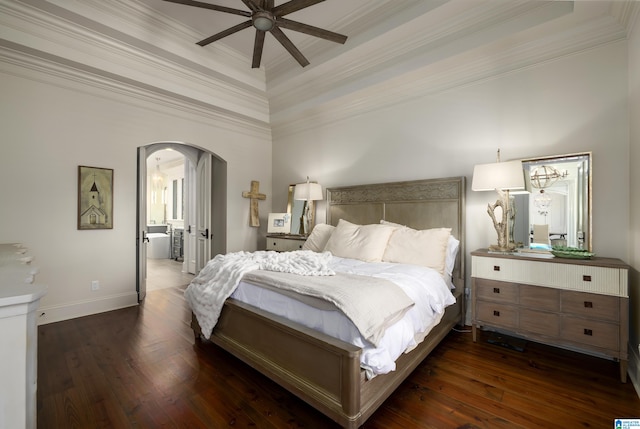 bedroom featuring ceiling fan, ornamental molding, dark wood-type flooring, and ensuite bath