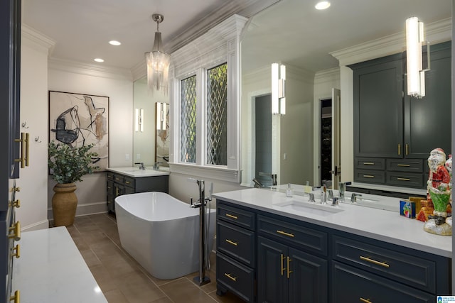 bathroom with tile patterned floors, crown molding, vanity, and a bath