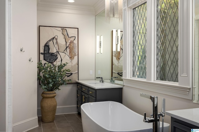 bathroom featuring tile patterned floors, crown molding, vanity, and a bath