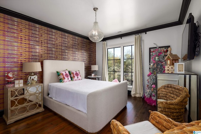 bedroom with dark hardwood / wood-style flooring and ornamental molding