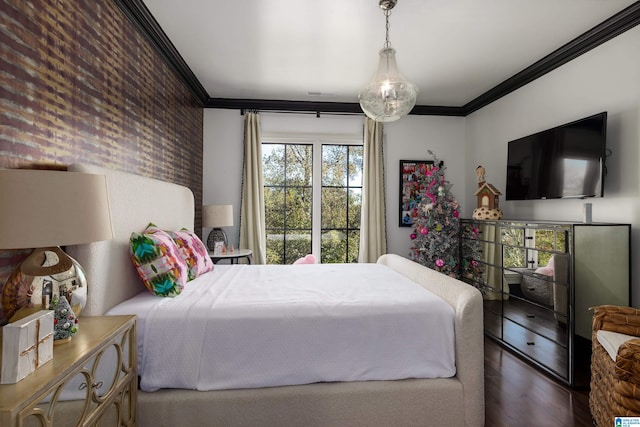 bedroom with hardwood / wood-style floors and ornamental molding