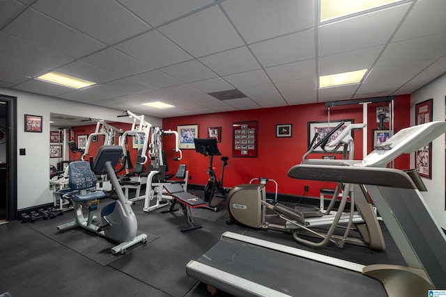 workout area with a paneled ceiling