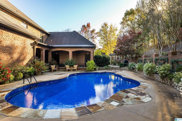 view of pool featuring a patio area