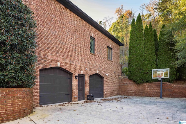 view of side of home featuring a garage