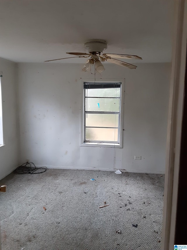 carpeted empty room with ceiling fan