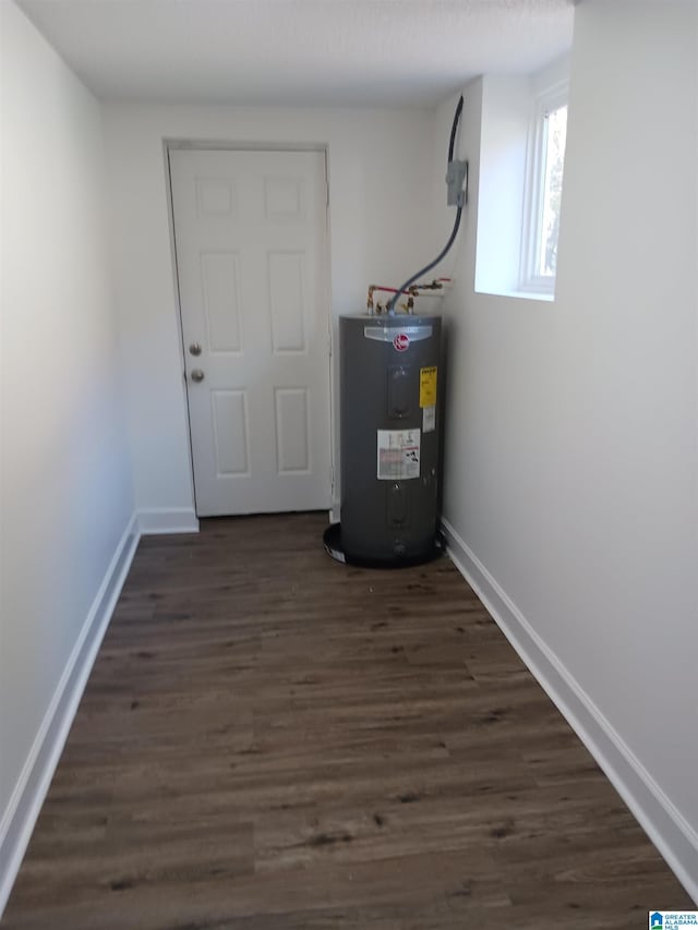 utility room featuring water heater