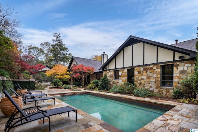 view of swimming pool featuring a patio