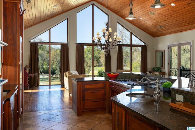 kitchen featuring sink, french doors, wooden ceiling, high vaulted ceiling, and light wood-type flooring