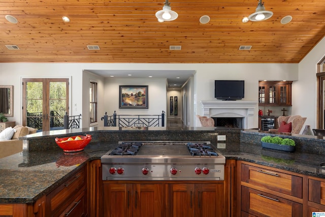 kitchen with hanging light fixtures, french doors, stainless steel gas stovetop, and wooden ceiling