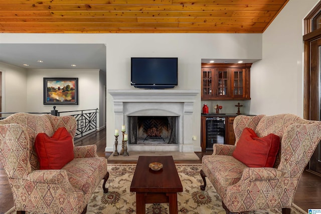 living room with dark hardwood / wood-style floors, wine cooler, and wooden ceiling