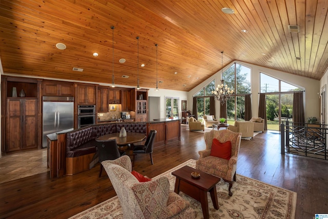 living room featuring a chandelier, wooden ceiling, high vaulted ceiling, and dark wood-type flooring