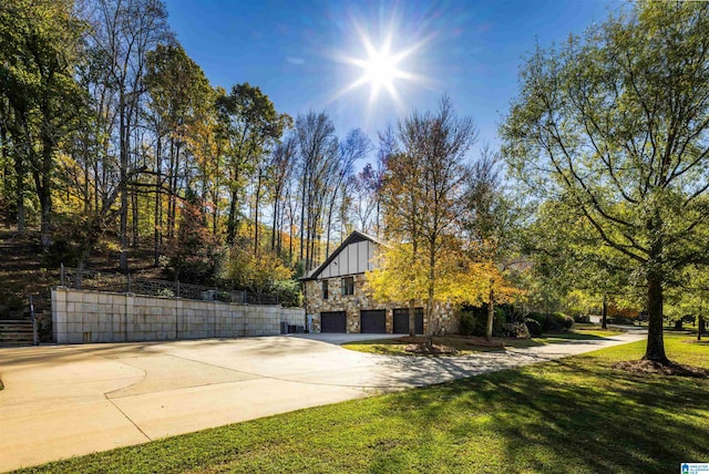 exterior space with a yard and a garage