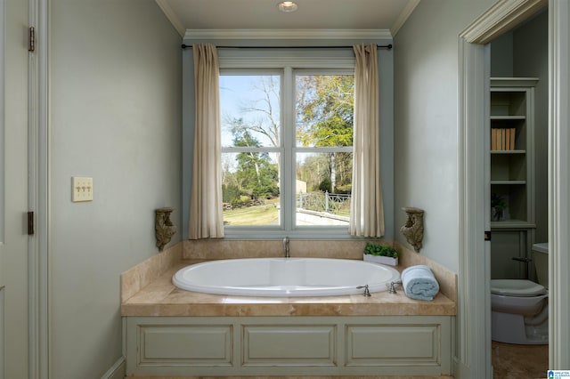 bathroom featuring toilet, ornamental molding, and a bath