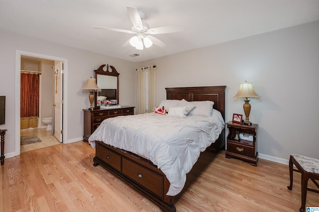 bedroom featuring connected bathroom, ceiling fan, and light hardwood / wood-style floors