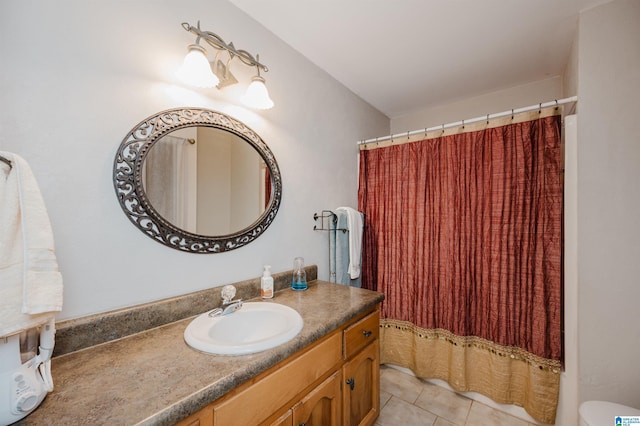 bathroom featuring tile patterned flooring and vanity