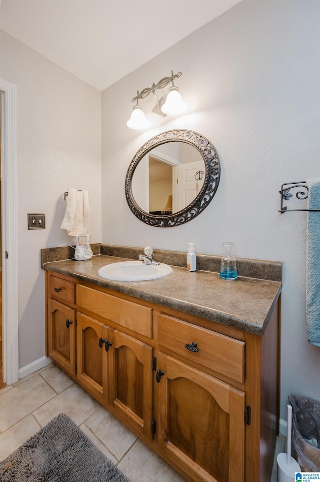 bathroom featuring tile patterned flooring and vanity