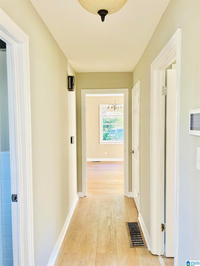 hallway featuring light wood-type flooring