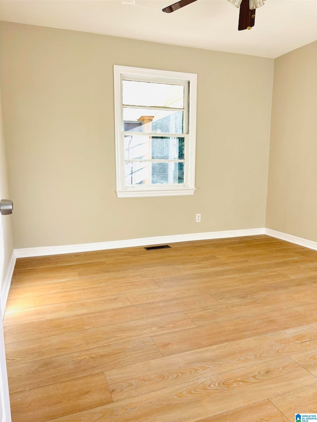 spare room featuring ceiling fan and light hardwood / wood-style flooring