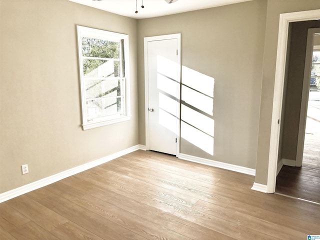 16 9th Ter, Birmingham, AL 35211 - spare room featuring hardwood / wood-style flooring, ceiling fan, and baseboards