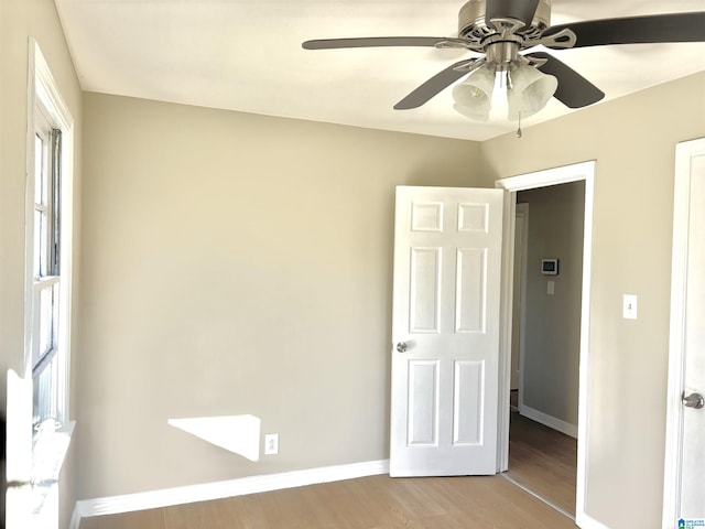 16 9th Ter, Birmingham, AL 35211 - unfurnished bedroom with light wood finished floors, baseboards, and ceiling fan