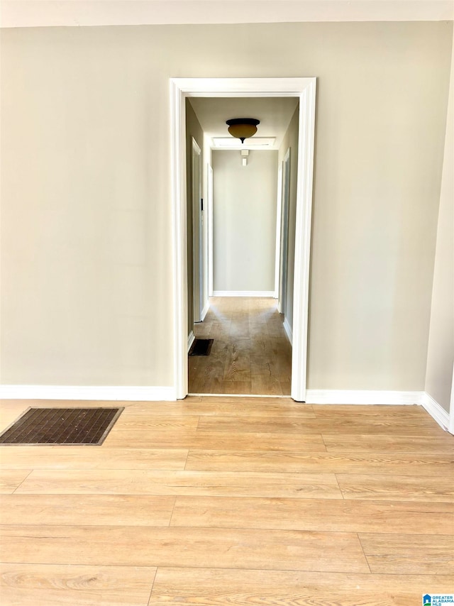 hallway with light wood-type flooring