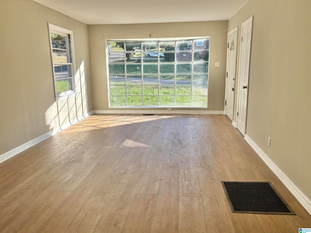 empty room with light wood-type flooring