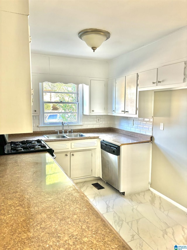 16 9th Ter, Birmingham, AL 35211 - kitchen with stainless steel dishwasher, a sink, tasteful backsplash, and light marble finish floors