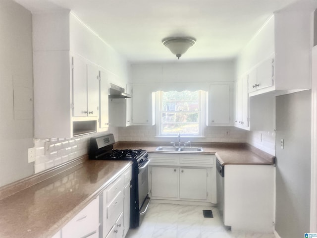 16 9th Ter, Birmingham, AL 35211 - kitchen with stainless steel appliances, a sink, under cabinet range hood, and tasteful backsplash