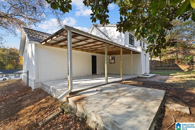 back of property featuring a patio