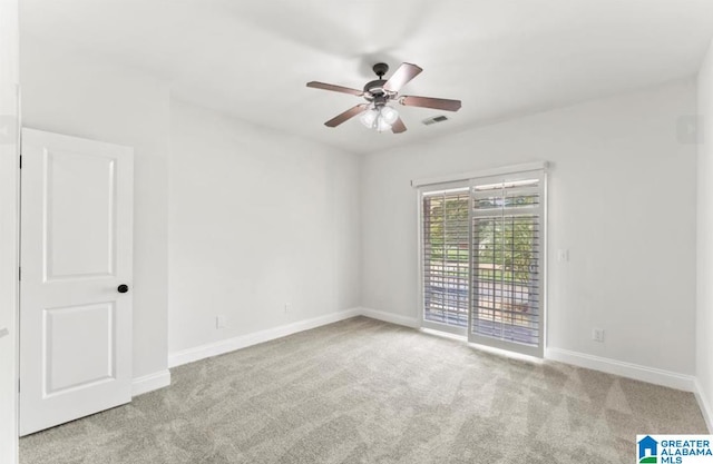 unfurnished room featuring ceiling fan and light colored carpet