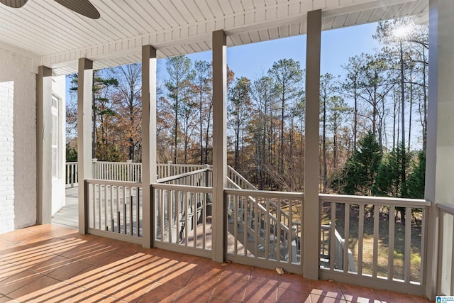 wooden terrace featuring ceiling fan