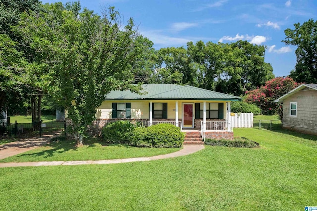 ranch-style house with a porch and a front lawn