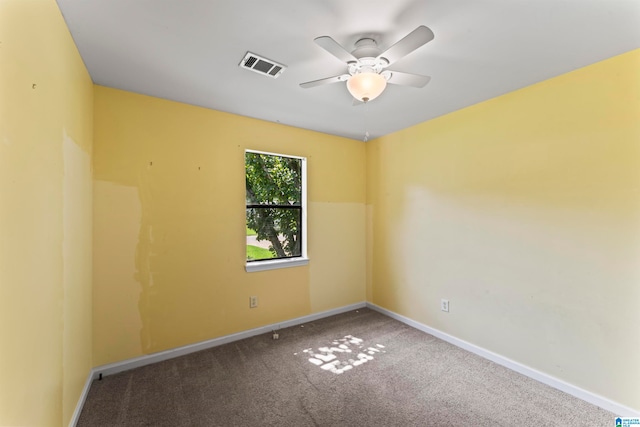 spare room featuring carpet floors and ceiling fan