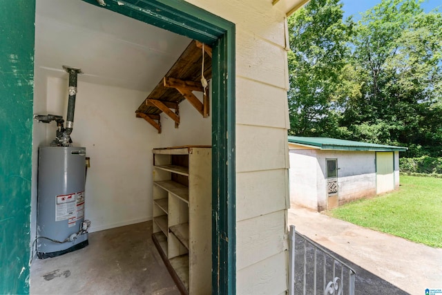 utility room featuring water heater