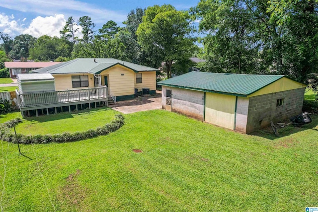 view of yard with a patio area and a deck