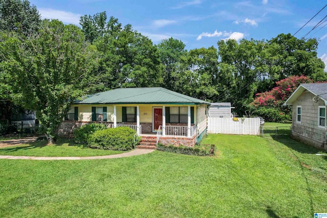 view of front of home featuring covered porch and a front yard