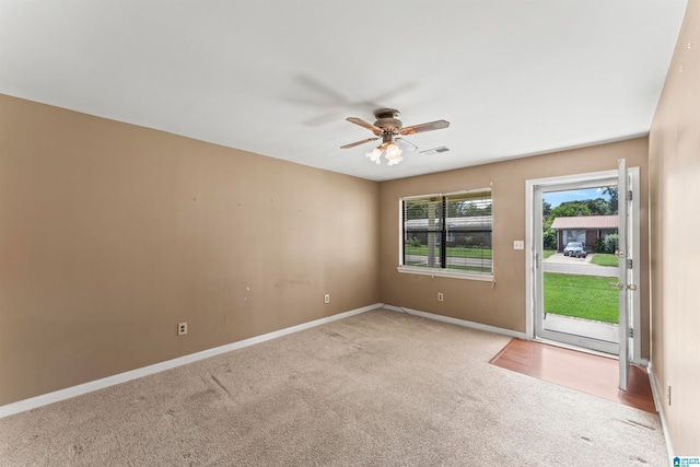 carpeted empty room with ceiling fan